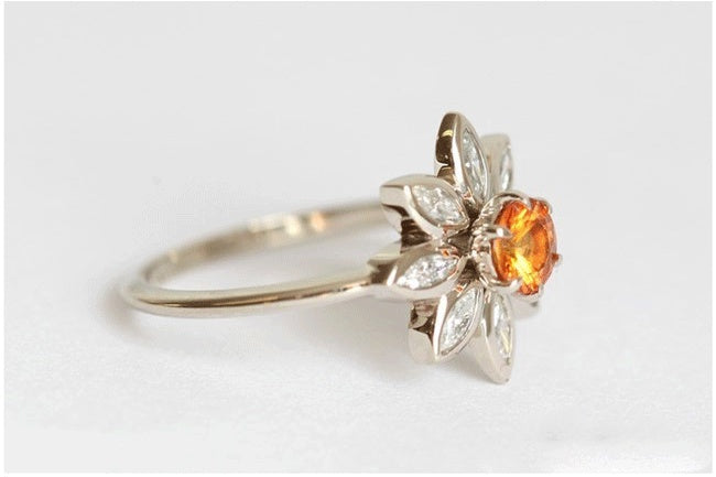 Velora diamond studded sunflower ring with orange center stone and delicate silver petals