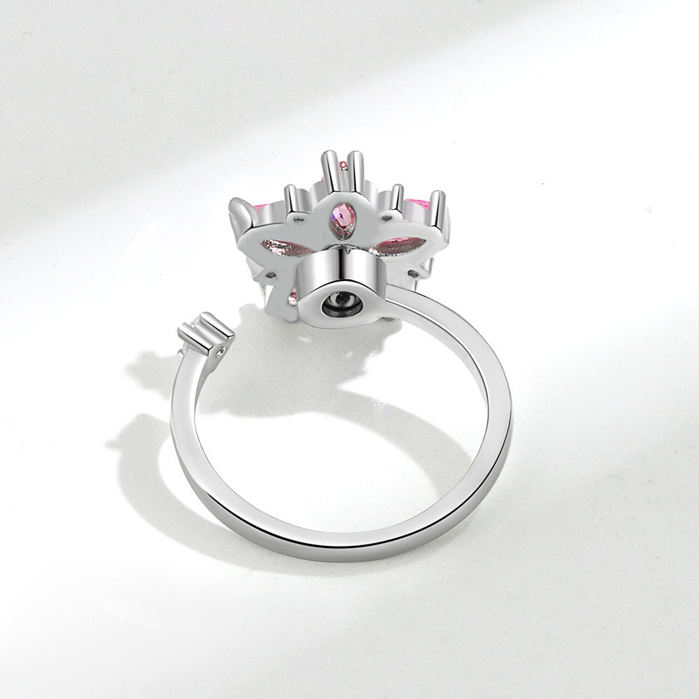 Velora flower spinner ring for women in silver with pink gemstone accents