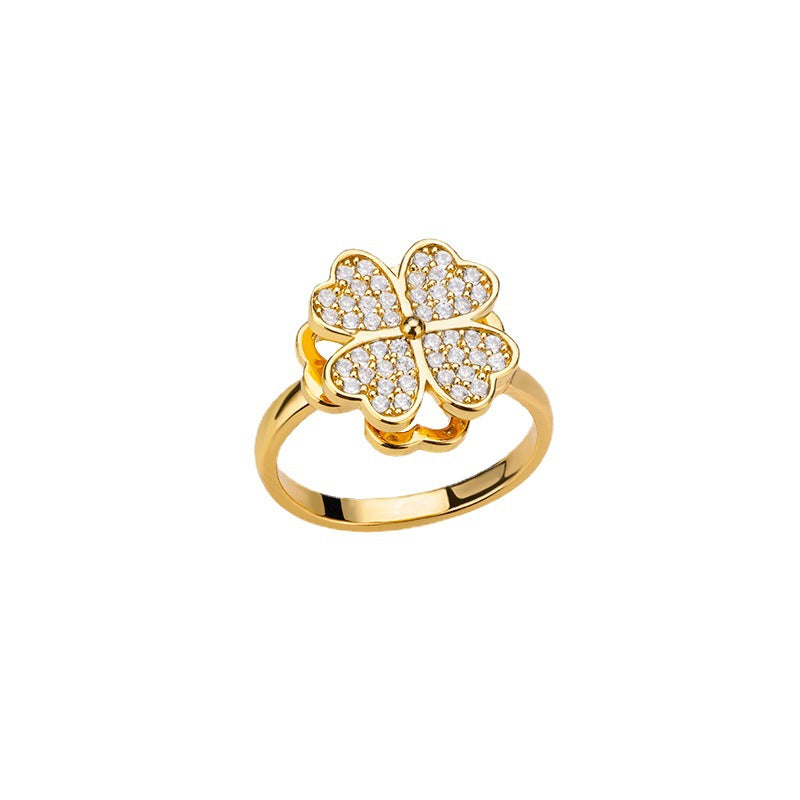 Velora Ring gold flower design anxiety ring with four-leaf clover and sparkling stones