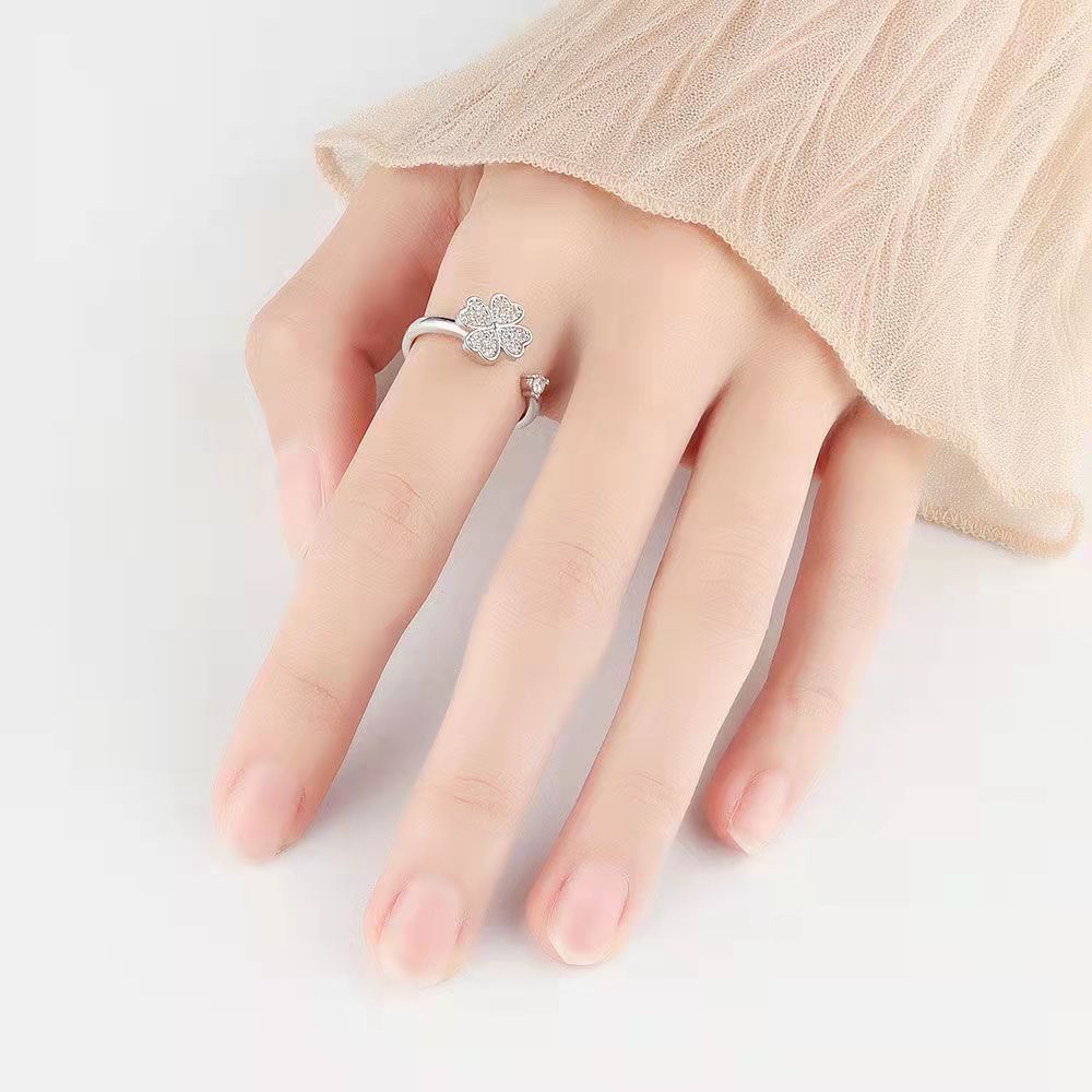 Velora Ring silver star and moon jewelry ring worn on hand with sheer beige sleeve