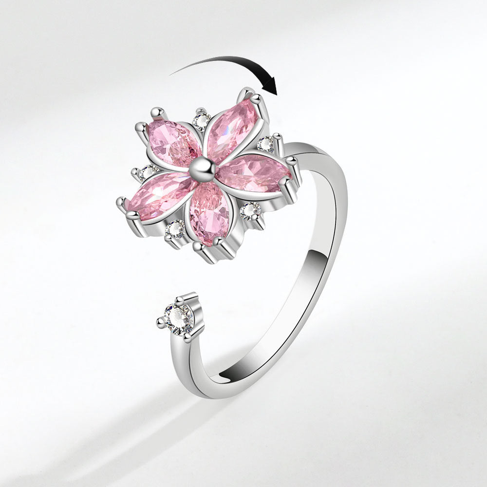 Velora flower spinner ring for women with pink gemstones and silver adjustable band