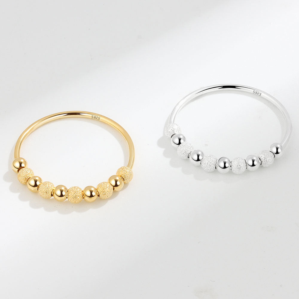 Velora Ring frosted rotation ring in gold and silver with textured and smooth beads