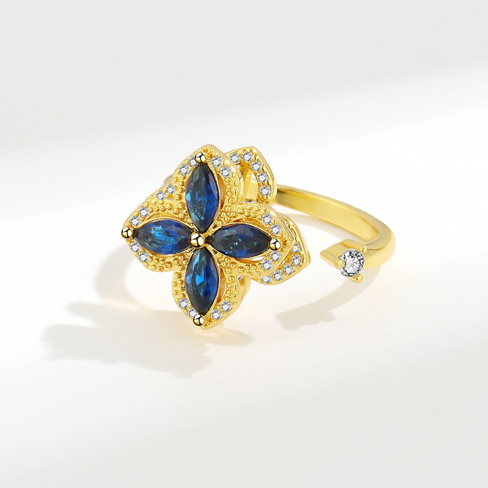 Gold Velora Ring with blue zircon stones and small crystals zircon decompression ring for women
